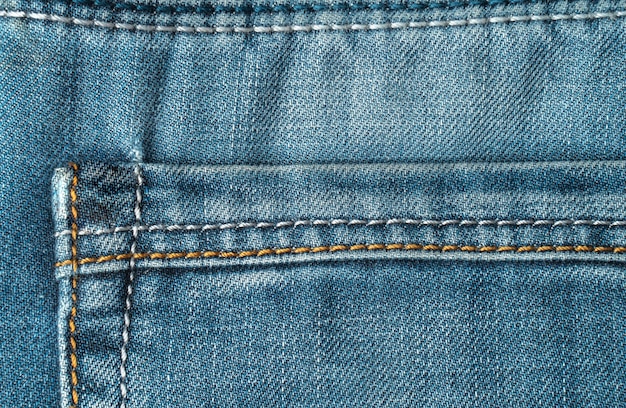 Pocket of blue jeans old jeans closeup