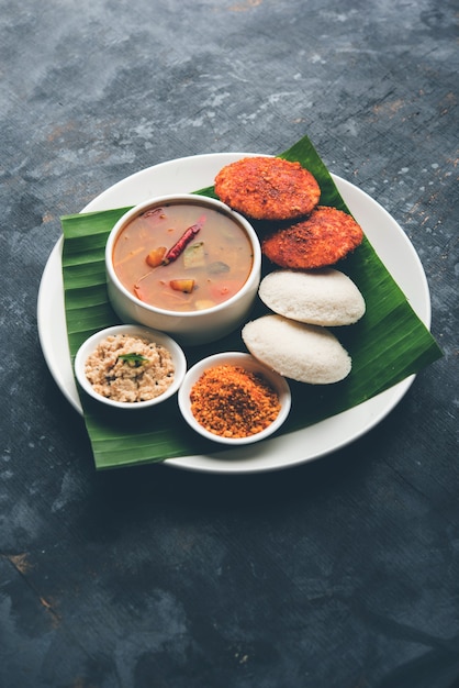 Podi idli is a quick and easy snack made with leftover idly. served with sambar and coconut chutney. selective focus