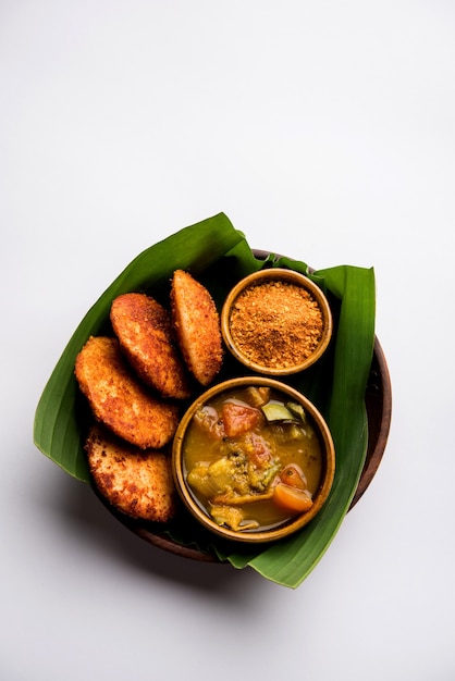 Podi idli is a quick and easy snack made with leftover idly. served with sambar and coconut chutney. selective focus