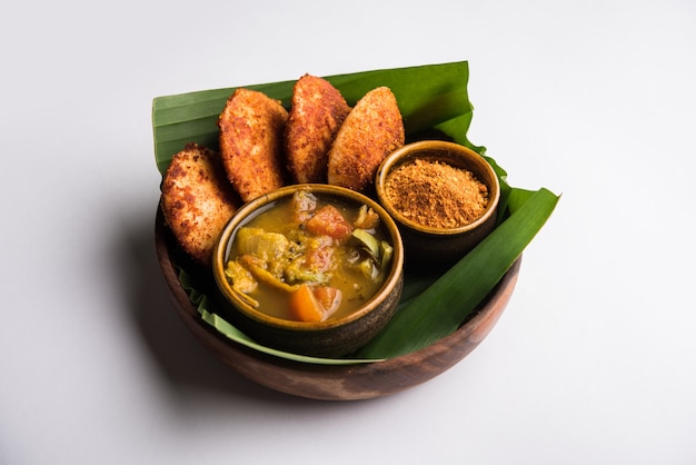 Podi idli is a quick and easy snack made with leftover idly. served with sambar and coconut chutney. selective focus