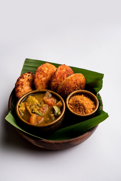 Podi idli is a quick and easy snack made with leftover idly. served with sambar and coconut chutney. selective focus