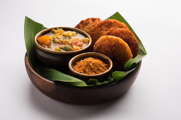 Podi idli is a quick and easy snack made with leftover idly. served with sambar and coconut chutney. selective focus