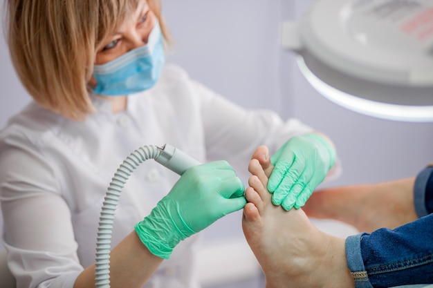 Podiatry doctor treating feet and nails