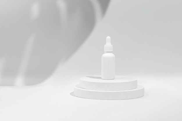 Podium display scene with shadow Mockup of beauty cosmetic makeup bottle with pipette product