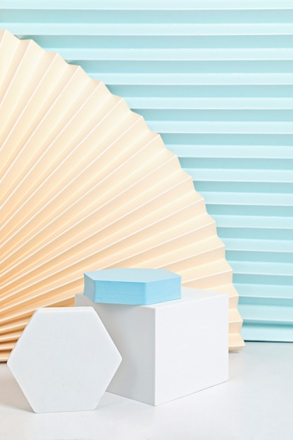 Podium, stand, platform for product presentation. Abstract wall made of paper fans.