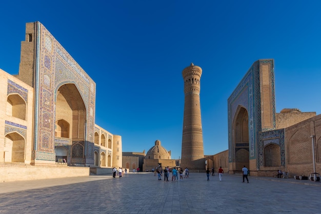 PoiKalyan square at daylight with Kalyan minaret ancient madrasah and mosque Bukhara Uzbekistan