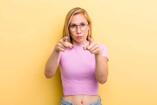 Pointing forward at camera with both fingers and angry expression telling you to do your duty