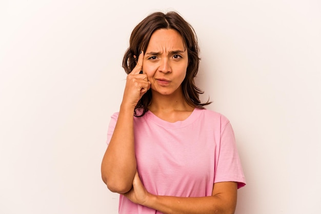 Pointing temple with finger thinking focused on a task