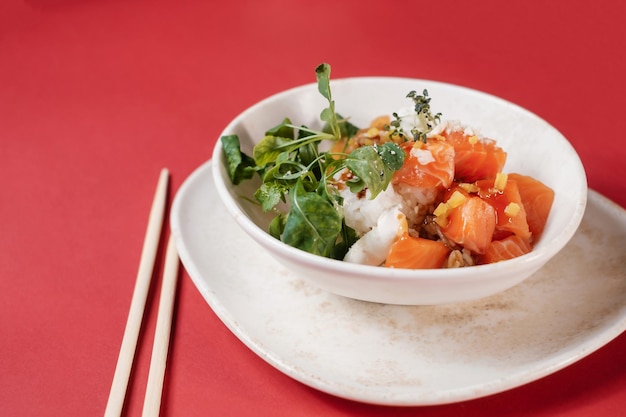 Poke bowl salad with fish salmon and greens