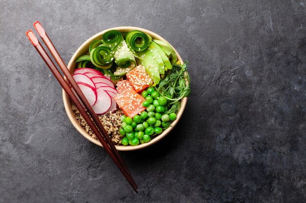 Poke bowl with salmon cucumber and avocado