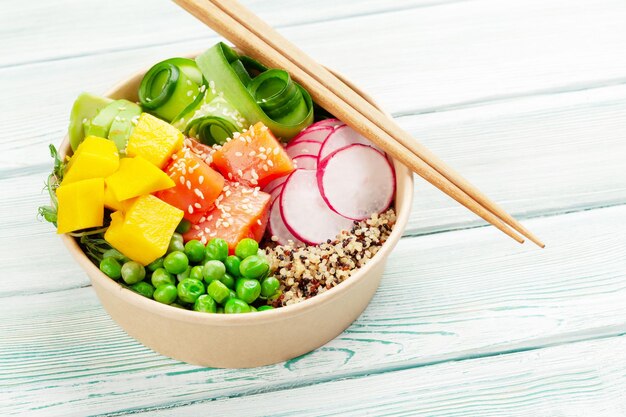 Poke bowl with salmon cucumber and mango