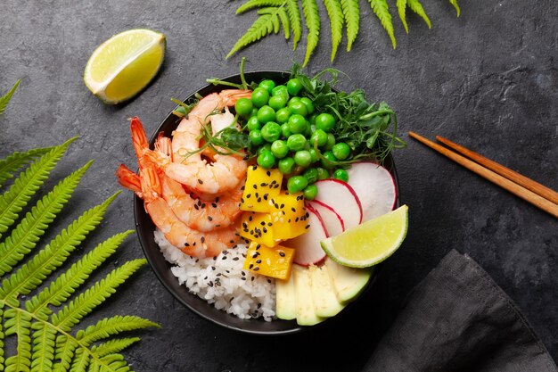 Poke bowl with shrimps avocado and mango