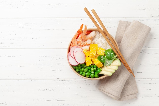 Poke bowl with shrimps avocado and mango