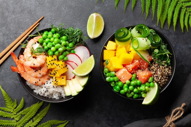 Poke bowls with shrimps salmon avocado and mango