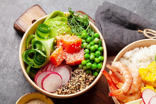 Poke bowls with shrimps salmon avocado and mango