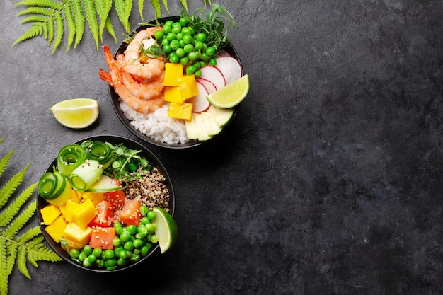 Poke bowls with shrimps salmon avocado and mango