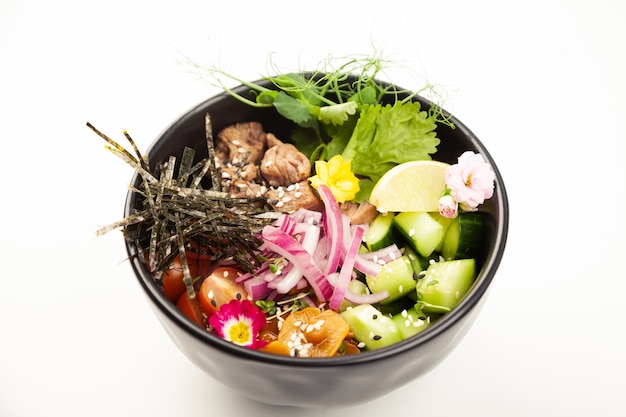 Poke salad with beef in a bowl ingredients beef nameko mushrooms cherry tomatoes rice cucumber red