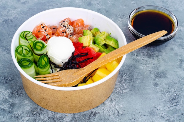 Poke with vegetables and fresh salmon. Studio Photo