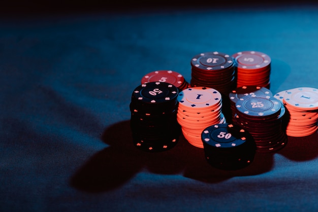 Poker chips are stacked as a bet