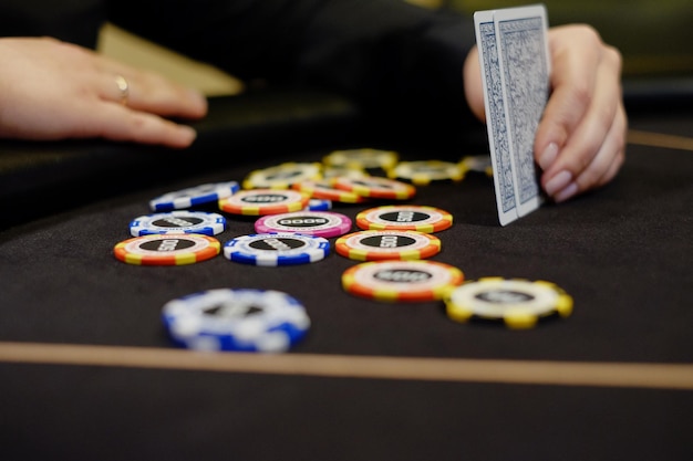 Poker chips on a table with a card on the table