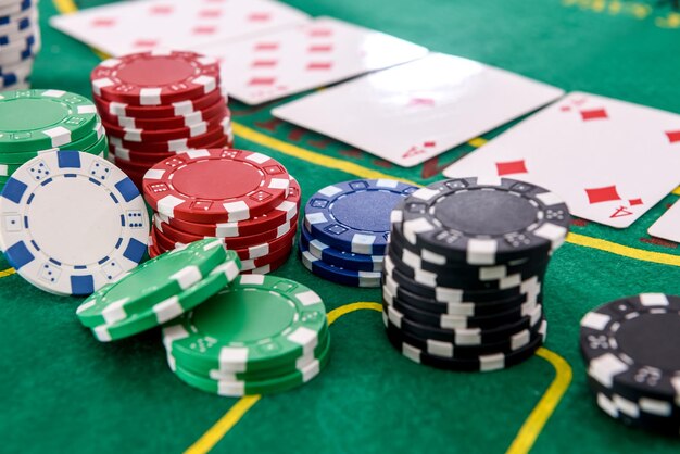 Poker chips with playing cards on table for blackjack. Casino and gambling