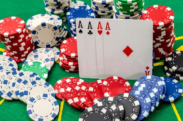 Poker game with four aces and chips