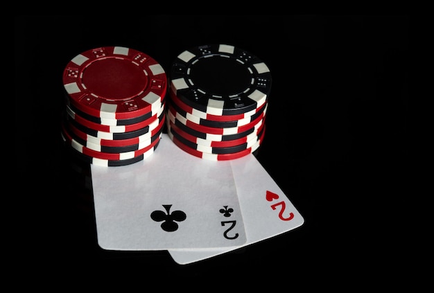 Poker game with one pair combination Chips and cards on the black table Successful and win