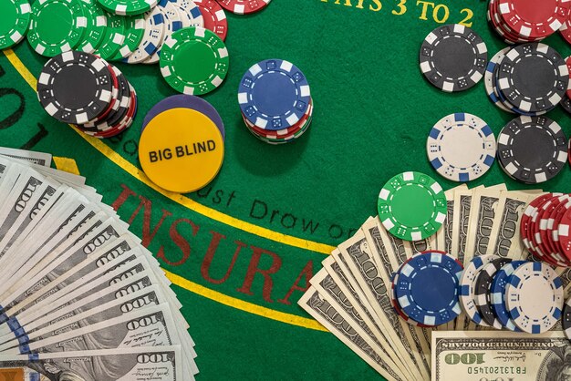 Poker playing chips with card and dollar banknoteson a casino green table. Online gambling. Texas