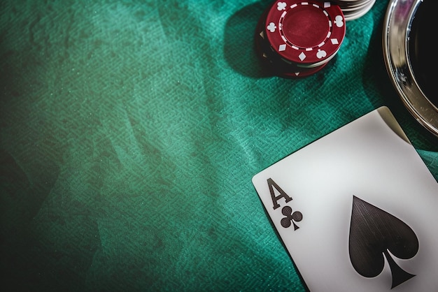 a poker table with a card and poker chips on it