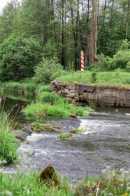 Polish border pole on the border line between Poland and Belarus