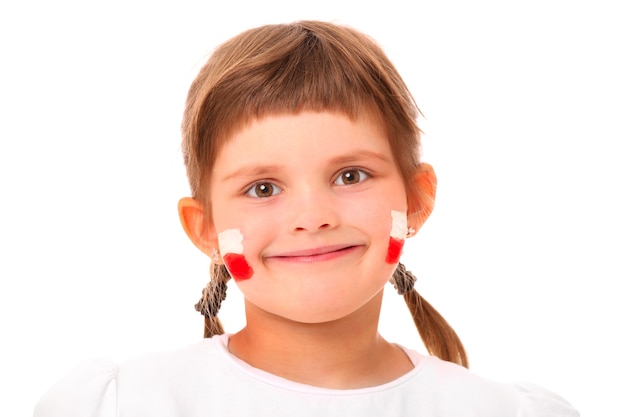 a Polish little girl in national colors smiling over white