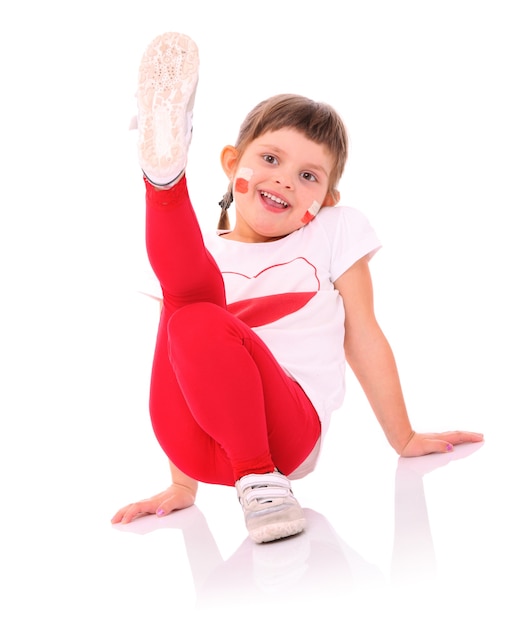 a Polish little girl in national colors smiling over white