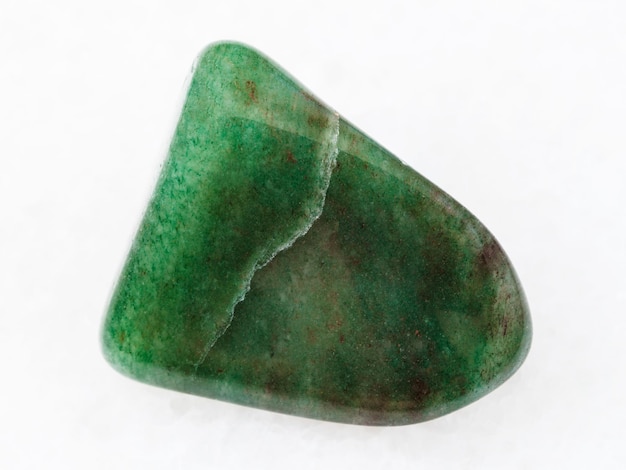 Polished green aventurine gem stone on white