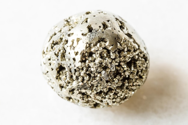 Polished Pyrite fool's gold rock on white