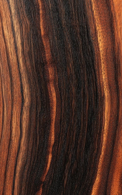 Polished rosewood dark and smooth with a rich grain