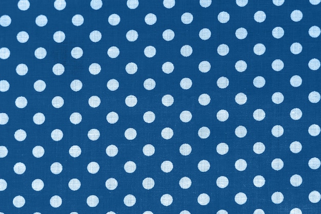 Polka dot on blue canvas cotton texture