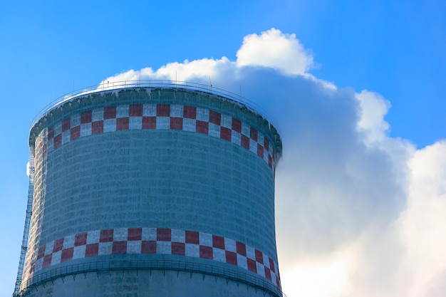 Pollution, emissions - thick smoke is coming out of the pipe into the atmosphere