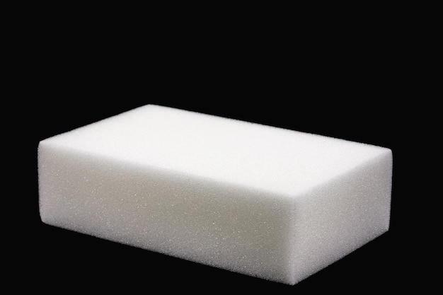 Polyester foam block used in building construction packaging filling or upholstery isolated black background copyspace