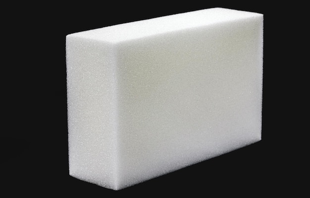 Polyester foam block used in building construction packaging filling or upholstery isolated black background copyspace