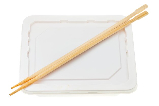 Polystyrene cup and wooden chopsticks