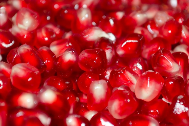 Pomegranate berries background. Bright appetising pomegranate berries