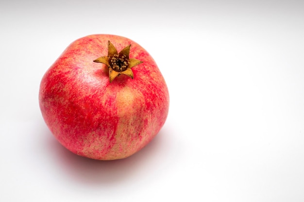 Pomegranate isolated on white background.