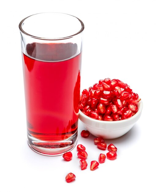 Pomegranate juice and fruit in ceramic bowl