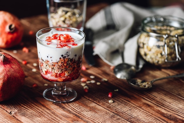 Pomegranate Parfait with Ingredients on Backdrop