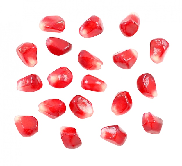 Pomegranate seeds are separated, red fruit isolated on white background with clipping path. Full depth of field.