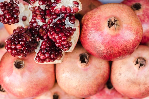 pomegranate seeds showcase with pomegranates a handful of pomegranates