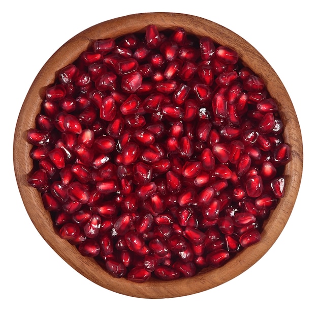 Pomegranate seeds in a wooden bowl on a white background