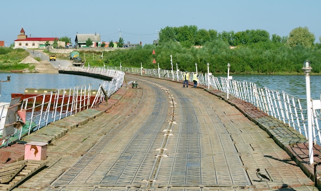 Pontoon bridge over the Oka river on a Sunny summer day