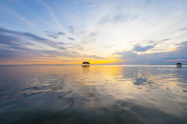 Pontoon floating on the water at sunset background