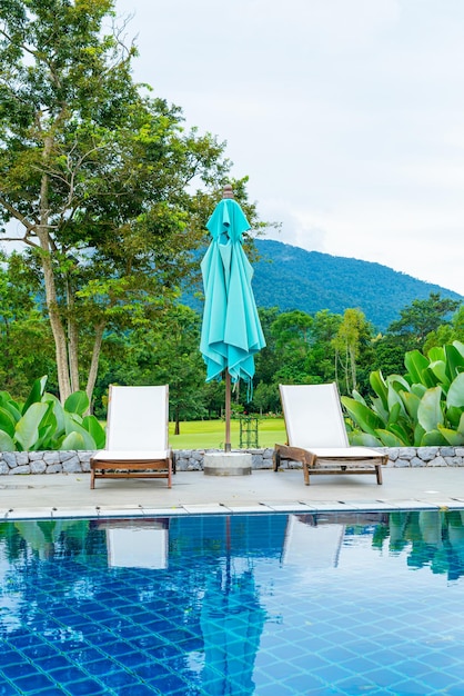 Pool bed around swimming pool with mountain hill background